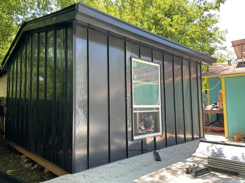 Black standing seam metal wall panels for Roof Inspection in Moss Point